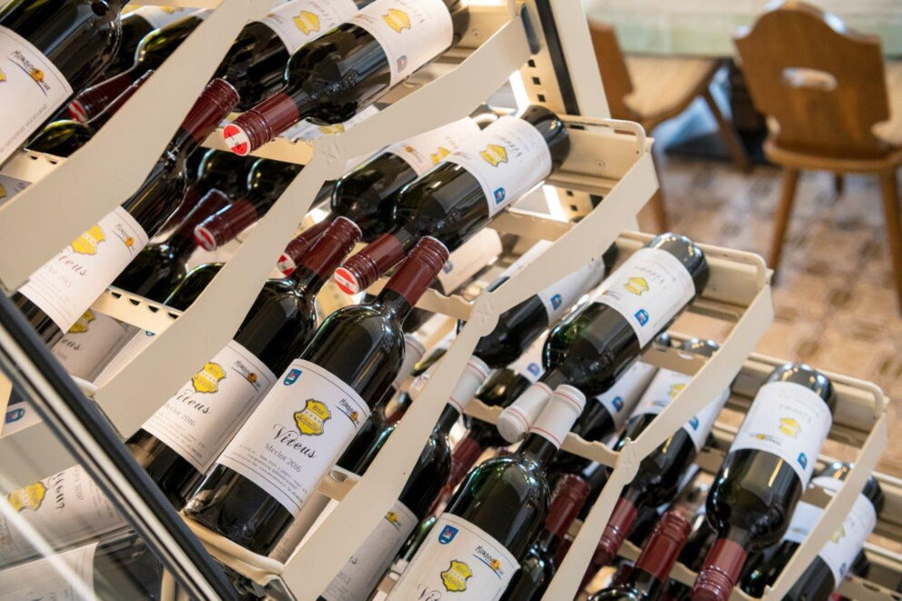 A fridge in the private hotel Das Schmidt filled with wine.