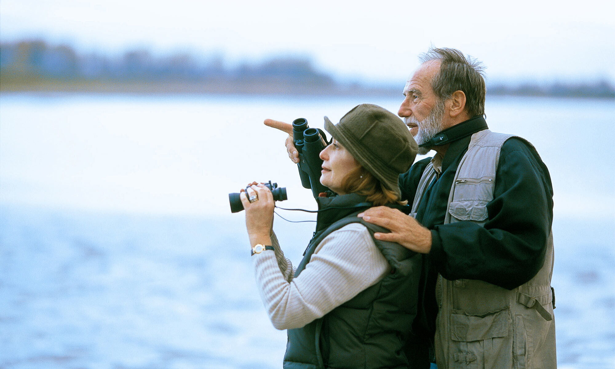 An elderly couple birdwatching at the Lake Neusiedl National Park